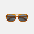 Orange sunglasses with dark lenses on a light gray background