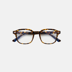 Tortoiseshell eyeglasses on a light gray background